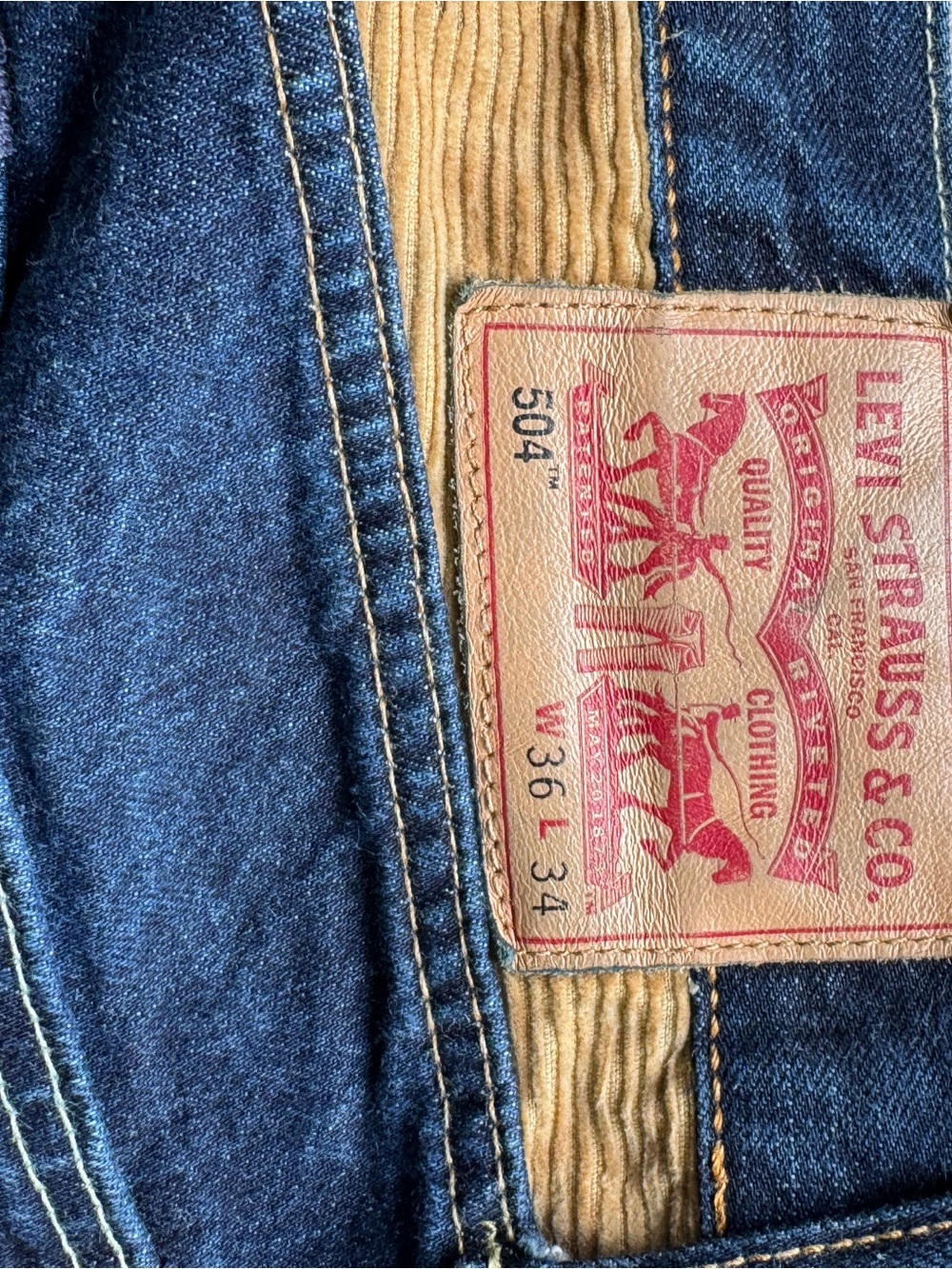 Levi's Men's Slim Straight Blue Jeans with Tan Patch Detail
